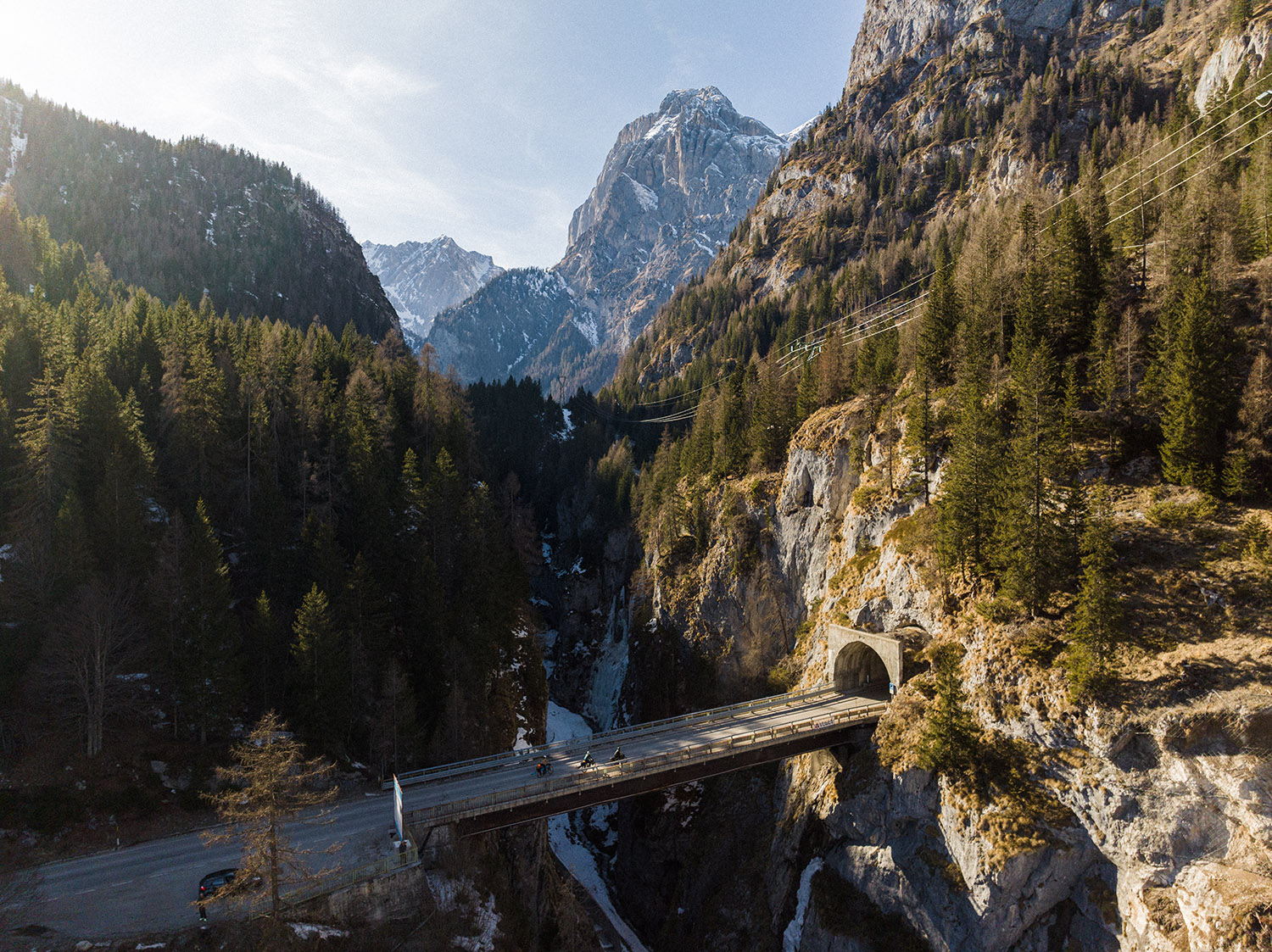 Three girls with 40-kilogram bikes loaded with ski gear crossing the Alps.